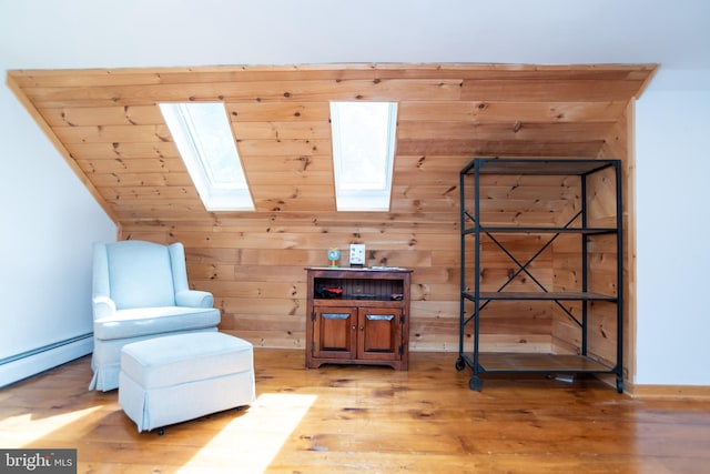 303 N Elm Ave, Newtown, PA 18940 - sitting room featuring a skylight, wood finished floors, baseboard heating, and wooden walls