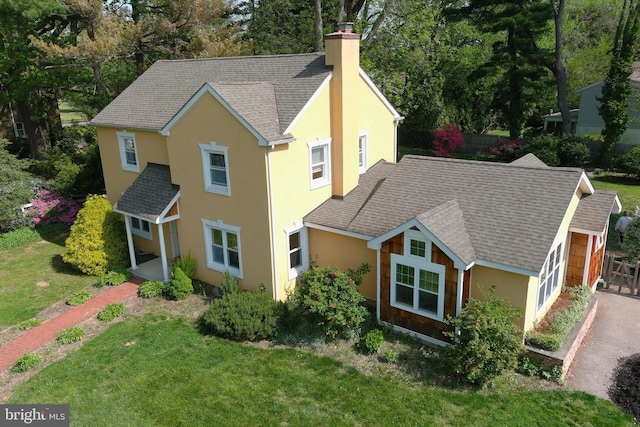 525 Croyden Rd, Cheltenham, PA 19012 - traditional home featuring a chimney, stucco siding, and roof with shingles