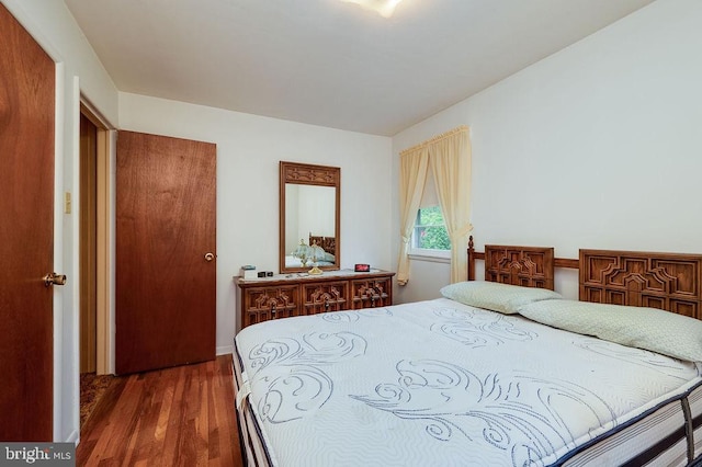 bedroom with wood finished floors