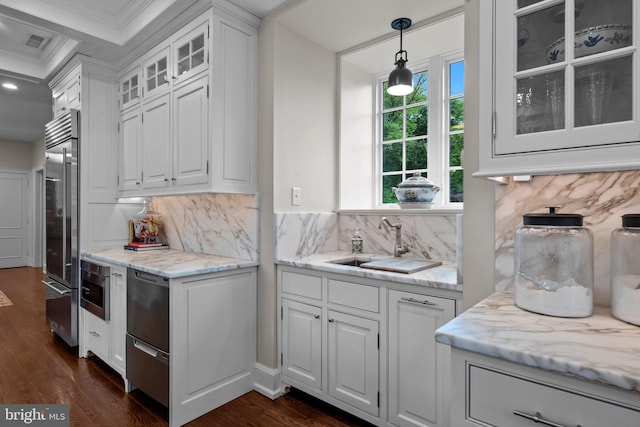 1182 Wrack Rd, Meadowbrook, PA 19046 - kitchen featuring built in refrigerator, a sink, dark wood finished floors, white cabinetry, and crown molding