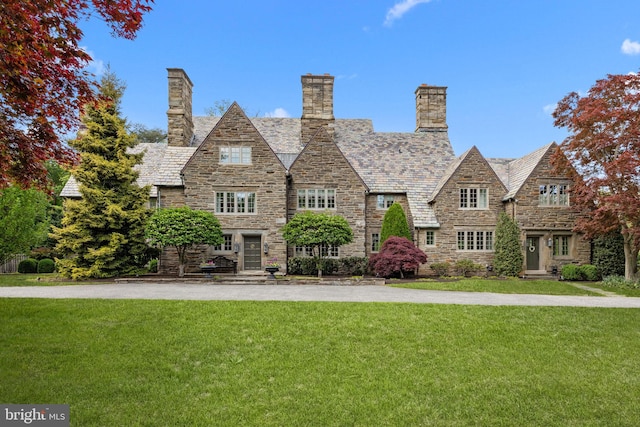 1182 Wrack Rd, Meadowbrook, PA 19046 - view of front of house with stone siding, a front lawn, and a high end roof