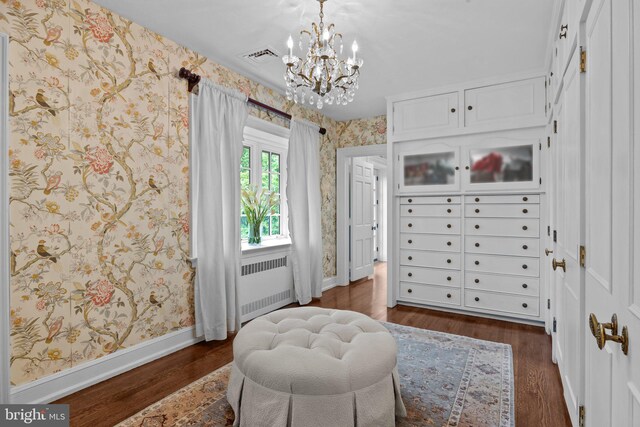 1182 Wrack Rd, Meadowbrook, PA 19046 - living area with radiator heating unit, wallpapered walls, dark wood-style floors, a chandelier, and baseboards