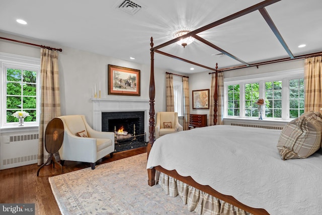 1182 Wrack Rd, Meadowbrook, PA 19046 - bedroom featuring radiator, a lit fireplace, wood finished floors, and recessed lighting