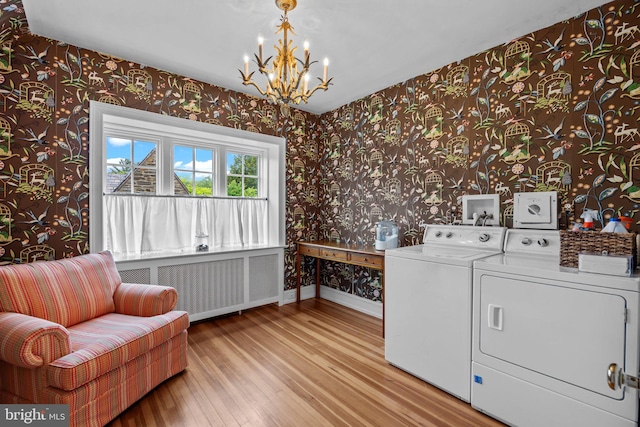 1182 Wrack Rd, Meadowbrook, PA 19046 - clothes washing area with wallpapered walls, separate washer and dryer, a chandelier, wood finished floors, and baseboards