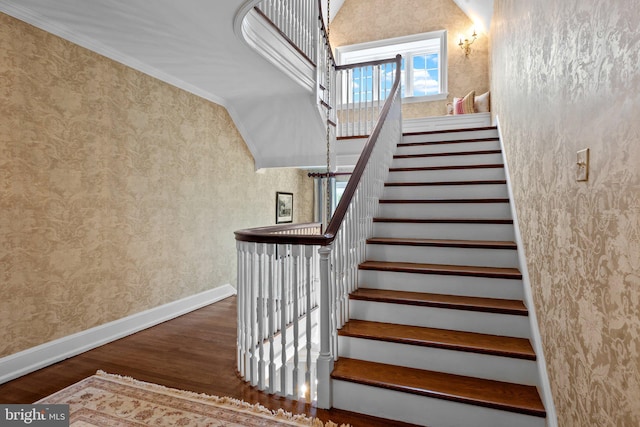 1182 Wrack Rd, Meadowbrook, PA 19046 - staircase with wood finished floors, wallpapered walls, crown molding, and baseboards
