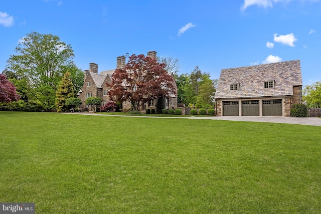 1182 Wrack Rd, Meadowbrook, PA 19046 - view of front of property featuring a front lawn, a chimney, concrete driveway, and an attached garage