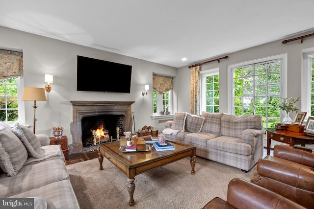 1182 Wrack Rd, Meadowbrook, PA 19046 - living area with a warm lit fireplace and plenty of natural light