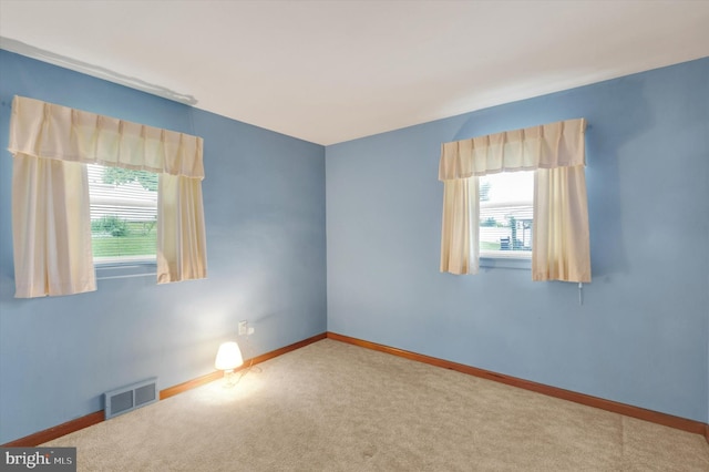 374 E Maple St, Dallastown, PA 17313 - empty room featuring healthy amount of natural light, carpet flooring, and baseboards