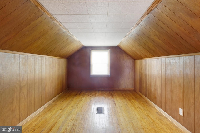 374 E Maple St, Dallastown, PA 17313 - additional living space with wood-type flooring, wood walls, and lofted ceiling
