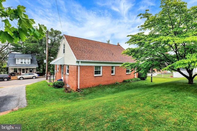 374 E Maple St, Dallastown, PA 17313 - view of side of property featuring brick siding and a chimney
