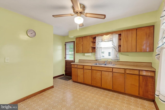 374 E Maple St, Dallastown, PA 17313 - kitchen with open shelves, a sink, light countertops, a ceiling fan, and baseboards