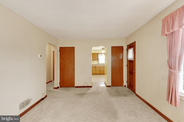 374 E Maple St, Dallastown, PA 17313 - unfurnished room with arched walkways, carpet, and baseboards