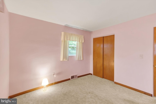 374 E Maple St, Dallastown, PA 17313 - unfurnished bedroom featuring carpet floors, a closet, and baseboards
