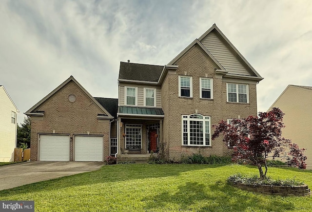 view of front of home featuring brick siding, driveway, a front yard, and a standing seam roof