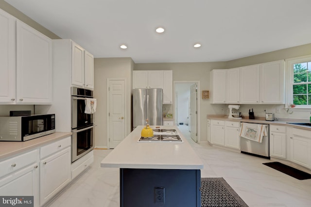 911 Echo Bay Ct, Gambrills, MD 21054 - kitchen featuring stainless steel appliances, white cabinetry, a kitchen island, light countertops, and recessed lighting