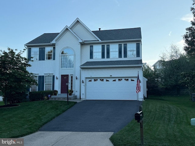 20355 Snowpoint Pl, Ashburn, VA 20147 - view of front facade featuring asphalt driveway, an attached garage, and a front yard