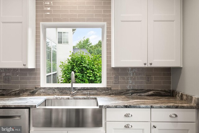 20355 Snowpoint Pl, Ashburn, VA 20147 - kitchen with a sink, backsplash, white cabinetry, and dark stone counters