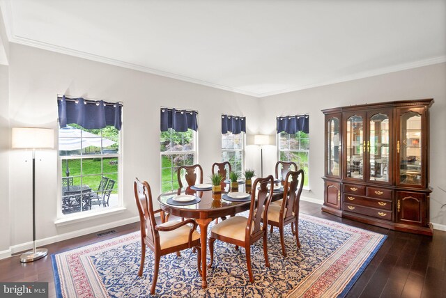 20355 Snowpoint Pl, Ashburn, VA 20147 - dining area featuring crown molding, dark wood finished floors, and baseboards