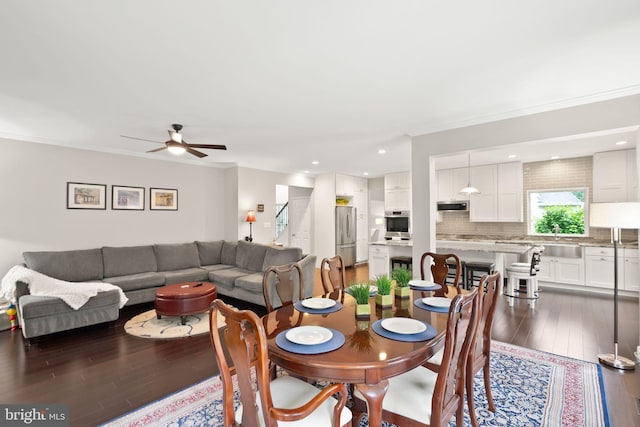 20355 Snowpoint Pl, Ashburn, VA 20147 - dining space featuring light wood-style flooring, crown molding, and a ceiling fan