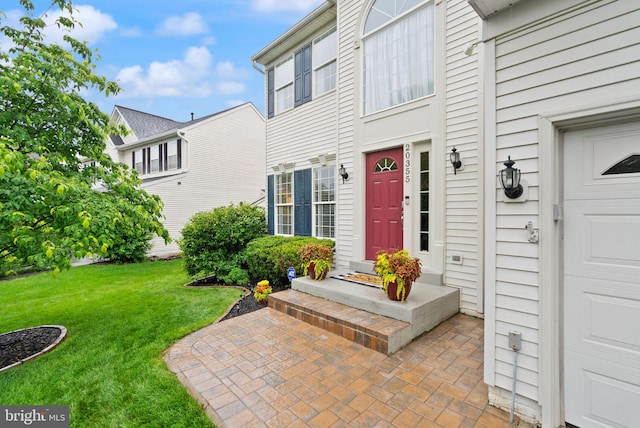 20355 Snowpoint Pl, Ashburn, VA 20147 - doorway to property with a lawn and a garage