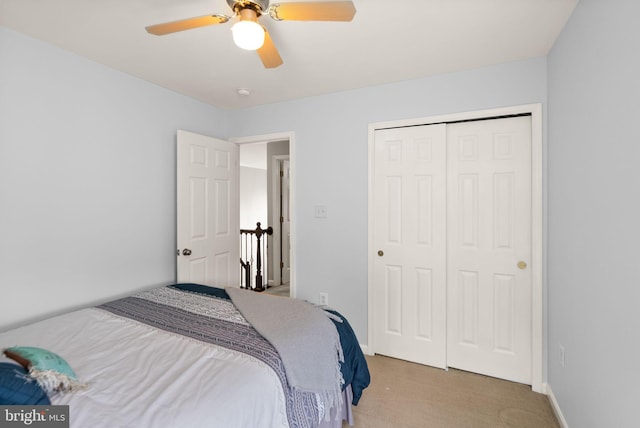 20355 Snowpoint Pl, Ashburn, VA 20147 - bedroom featuring light carpet, a closet, a ceiling fan, and baseboards