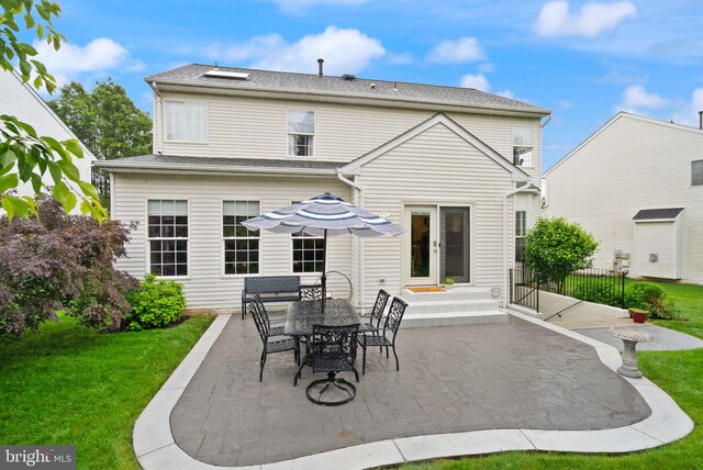 20355 Snowpoint Pl, Ashburn, VA 20147 - rear view of property featuring a patio and a yard