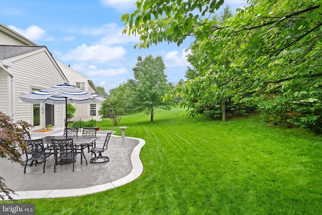 20355 Snowpoint Pl, Ashburn, VA 20147 - view of grassy yard with a patio