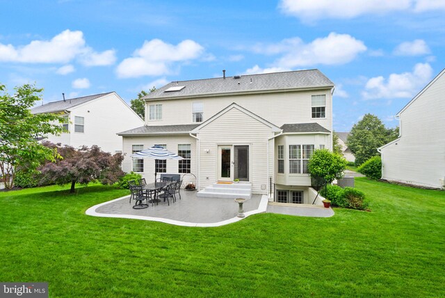 20355 Snowpoint Pl, Ashburn, VA 20147 - rear view of house featuring a patio and a lawn