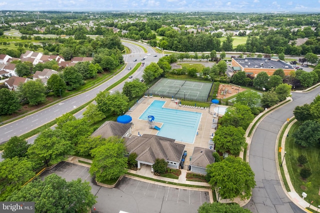 20355 Snowpoint Pl, Ashburn, VA 20147 - aerial perspective of suburban area featuring a pool and a tree filled landscape