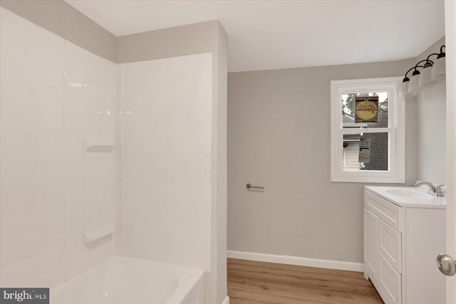 134 S Market St, New Cumberland, PA 17070 - bathroom with wood finished floors, baseboards, and vanity