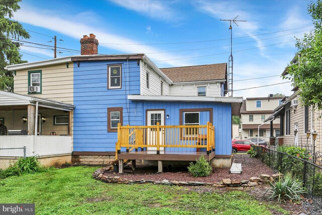134 S Market St, New Cumberland, PA 17070 - back of house featuring a wooden deck, a chimney, and roof with shingles
