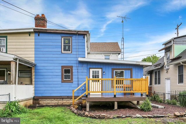 134 S Market St, New Cumberland, PA 17070 - back of house with a wooden deck, a chimney, and a shingled roof