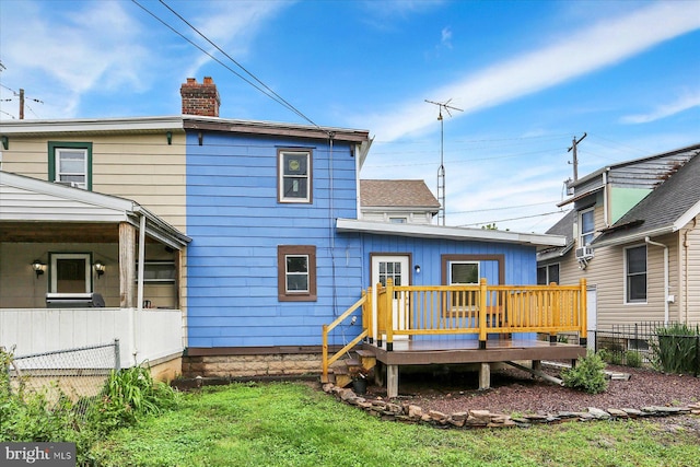 134 S Market St, New Cumberland, PA 17070 - rear view of house featuring a chimney and a wooden deck