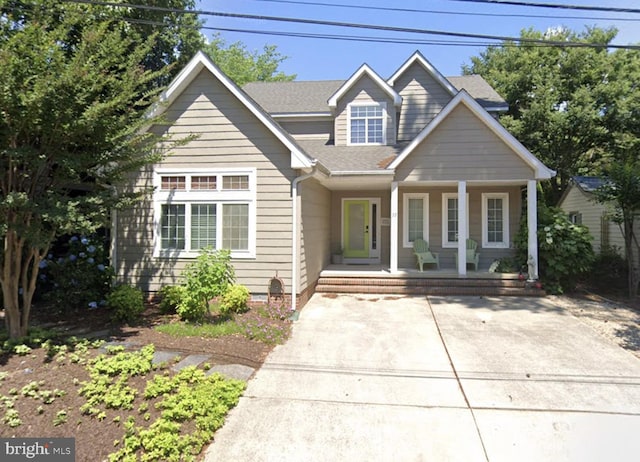 37 Sussex St, Rehoboth Beach, DE 19971 - view of front of home featuring a porch and roof with shingles