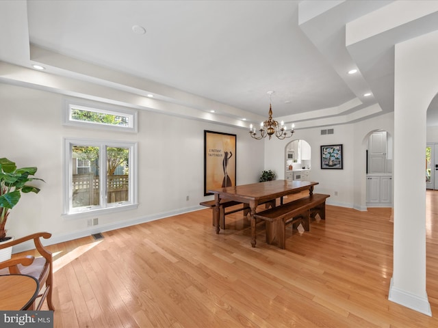 37 Sussex St, Rehoboth Beach, DE 19971 - dining area featuring arched walkways, a tray ceiling, light wood-type flooring, baseboards, and recessed lighting