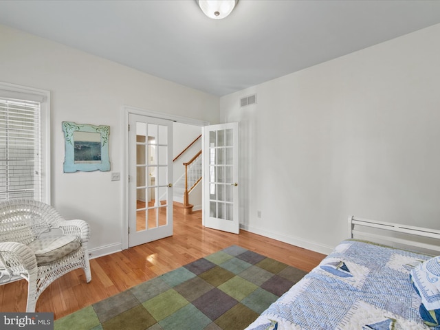 37 Sussex St, Rehoboth Beach, DE 19971 - bedroom featuring wood finished floors, french doors, and baseboards