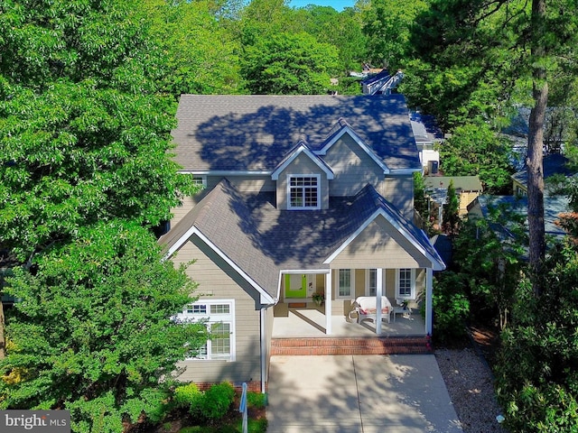 37 Sussex St, Rehoboth Beach, DE 19971 - view of front facade with covered porch and roof with shingles