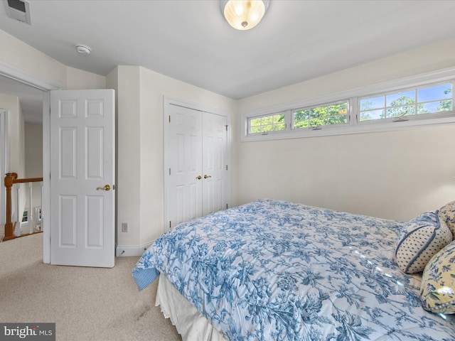 37 Sussex St, Rehoboth Beach, DE 19971 - bedroom with light colored carpet, a closet, and baseboards