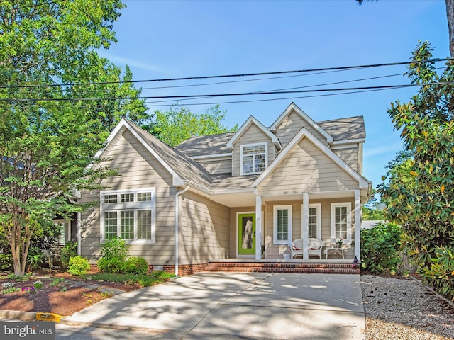 37 Sussex St, Rehoboth Beach, DE 19971 - traditional-style house featuring covered porch and a shingled roof
