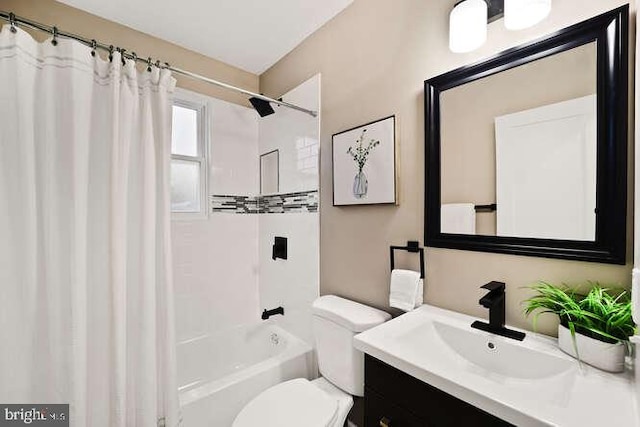 full bathroom with vanity, toilet, and shower / tub combo