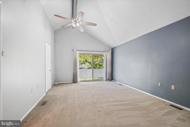 spare room with a ceiling fan, carpet flooring, high vaulted ceiling, and baseboards