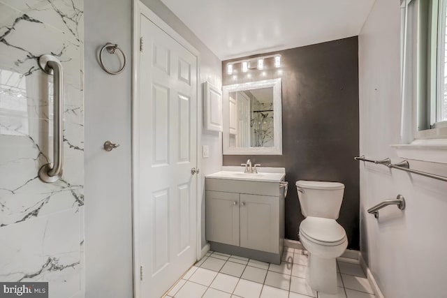 full bath with vanity, toilet, curtained shower, tile patterned flooring, and baseboards