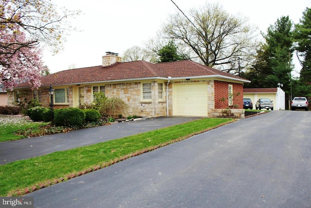 255 Pangborn Blvd, Hagerstown, MD 21740 - view of front facade featuring stone siding, a garage, a chimney, and driveway