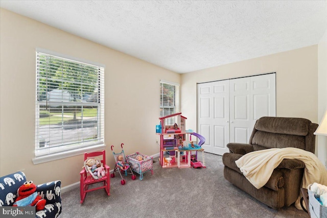501 Macmillan Ct, Arnold, MD 21012 - rec room with carpet flooring, plenty of natural light, a textured ceiling, and baseboards