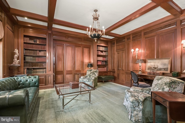 living area featuring built in shelves, a chandelier, coffered ceiling, beamed ceiling, and wooden walls