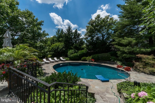 outdoor pool featuring a patio area