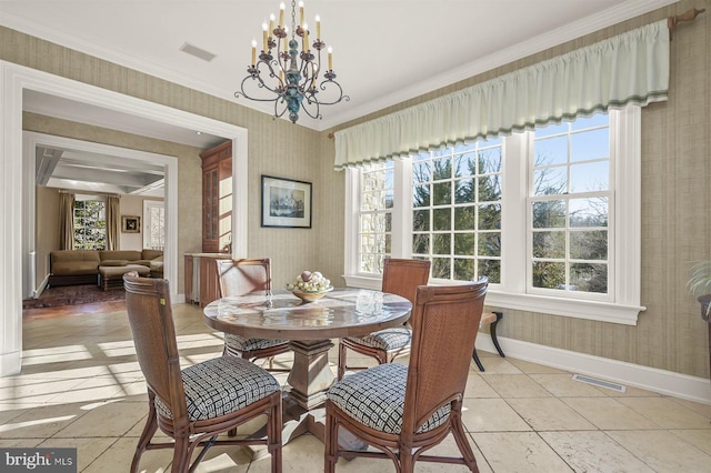 dining space with wallpapered walls, baseboards, a chandelier, ornamental molding, and light tile patterned flooring