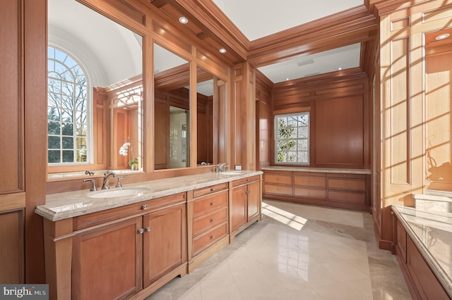 full bath with crown molding and double vanity