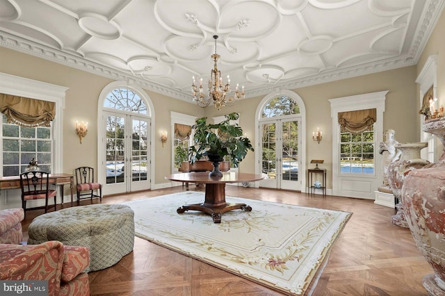 sunroom featuring french doors, coffered ceiling, and a chandelier