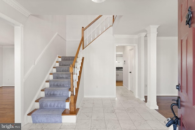 10 Sarasota Dr, Stafford, VA 22554 - staircase featuring decorative columns, marble finish floors, baseboards, and crown molding
